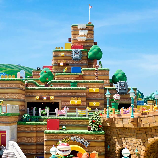 Elements such as gold coins, green warp pipes, and hidden power ups are all over Super Nintendo World
